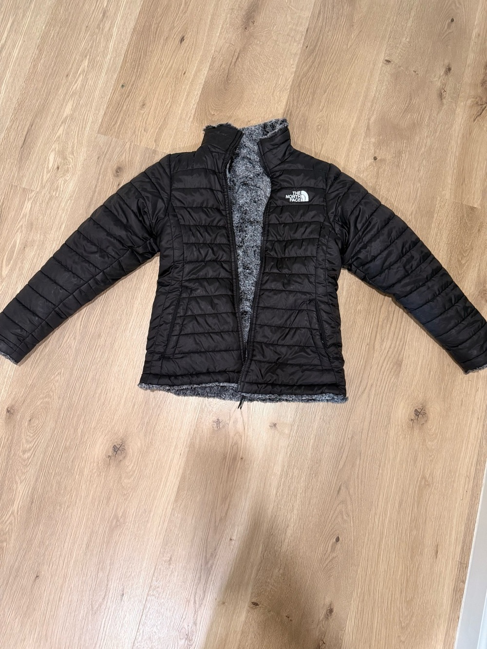 The North Face Kids Black Puffer Jacket with Gray Fleece Lining